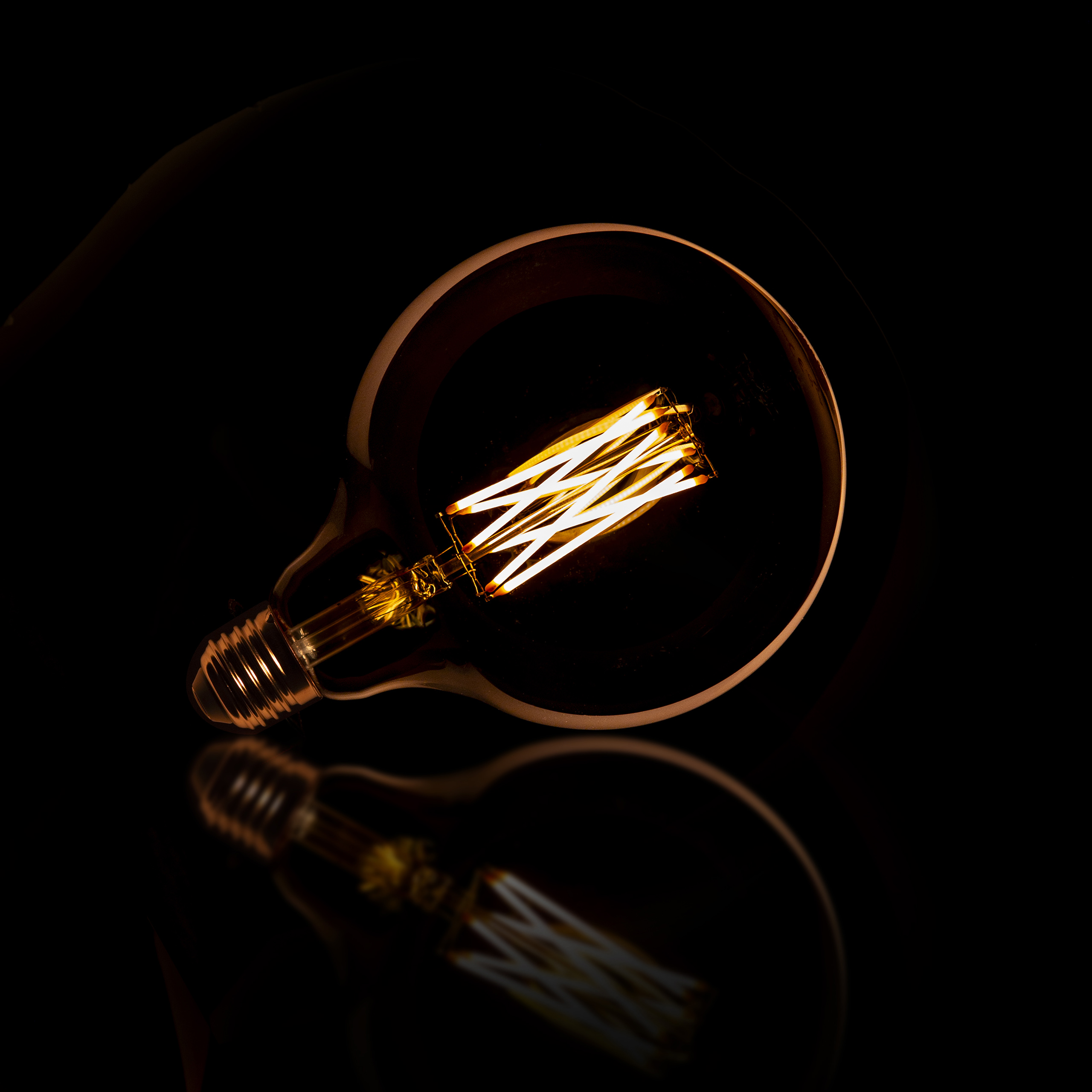 Ljuskälla LED [G125] glödlampa Ø12,5 - E27 6W dimbar / Bärnstensfärgad glas